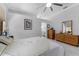 Bedroom featuring neutral walls and wood furnishings that add a natural element to the space at 14423 Tambourine Dr, Orlando, FL 32837