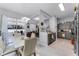 Modern dining area with stylish lighting, comfortable seating, and access to an outdoor patio at 14423 Tambourine Dr, Orlando, FL 32837
