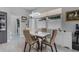 Dining area with modern table and chairs, stylish lighting, and views to the backyard at 14423 Tambourine Dr, Orlando, FL 32837