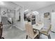 Bright dining area with modern lighting, open to the staircase, kitchen and a seating nook at 14423 Tambourine Dr, Orlando, FL 32837