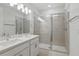 Bright bathroom featuring a double vanity with a tiled glass shower enclosure at 1462 Brookdale Ct, Oviedo, FL 32765