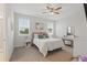 Bright bedroom featuring natural light from windows and a comfortable bed with charming decor at 1462 Brookdale Ct, Oviedo, FL 32765
