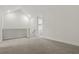 Large bonus room with neutral carpet and natural light; laundry room access visible in background at 1462 Brookdale Ct, Oviedo, FL 32765