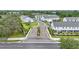 A welcoming view of the community entrance with well-maintained landscaping and modern townhomes at 1462 Brookdale Ct, Oviedo, FL 32765