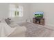 Cozy living room with neutral tones, light wood accents, and a plush sofa and decor at 1462 Brookdale Ct, Oviedo, FL 32765