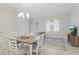 Inviting dining area and living room featuring lots of natural light and neutral decor at 1462 Brookdale Ct, Oviedo, FL 32765