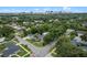 Aerial view of neighborhood with mature trees and skyline in the distance at 1519 N Westmoreland Dr, Orlando, FL 32804