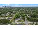 Aerial view of the neighborhood showcasing mature trees, well-kept homes, and the city skyline in the distance at 1519 N Westmoreland Dr, Orlando, FL 32804