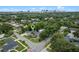 Aerial view of neighborhood with mature trees and skyline in the distance at 1519 N Westmoreland Dr, Orlando, FL 32804