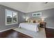 A spacious bedroom with wood floors, a vaulted ceiling, and lots of natural light coming in from the windows at 1519 N Westmoreland Dr, Orlando, FL 32804