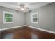 A vacant bedroom with natural light from windows and hard wood floors at 1519 N Westmoreland Dr, Orlando, FL 32804