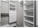 A walk-in closet with built-in shelving and drawers for organized storage at 1519 N Westmoreland Dr, Orlando, FL 32804
