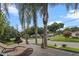 A relaxing deck area with a view of the neighborhood, palm trees, and outdoor seating at 1519 N Westmoreland Dr, Orlando, FL 32804