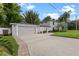 Well-maintained home with a spacious driveway, attached garage, and lush front yard at 1519 N Westmoreland Dr, Orlando, FL 32804