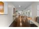 Inviting foyer with hardwood floors, a console table, and an open view to the living space at 1519 N Westmoreland Dr, Orlando, FL 32804