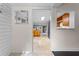 Hallway view into the kitchen featuring tile flooring and natural lighting at 1519 N Westmoreland Dr, Orlando, FL 32804