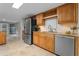 Kitchen with wood cabinets, stainless steel appliances, and stone countertops at 1519 N Westmoreland Dr, Orlando, FL 32804
