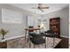 Comfortable home office featuring a ceiling fan, and a classic wood bookcase at 1519 N Westmoreland Dr, Orlando, FL 32804