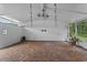 Spacious covered patio with brick flooring, lighting, and access to the backyard area at 1519 N Westmoreland Dr, Orlando, FL 32804