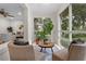 Inviting sunroom featuring tile flooring, large windows, and stylish furnishings at 1519 N Westmoreland Dr, Orlando, FL 32804