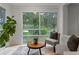 Relaxing sunroom with large windows overlooking the landscaped yard and tile flooring at 1519 N Westmoreland Dr, Orlando, FL 32804