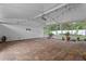 A sunroom featuring brick floors, a vaulted ceiling, and space for plants and other features at 1519 N Westmoreland Dr, Orlando, FL 32804