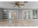 Bright sunroom with tile flooring, neutral walls, and sliding glass doors at 1519 N Westmoreland Dr, Orlando, FL 32804