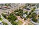 A wide aerial shot shows a neighborhood, with houses surrounded by mature landscaping and historical brick roads at 16103 Denham Ct, Clermont, FL 34711