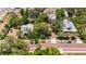 Aerial view of the homes in the neighborhood, nestled amongst mature landscaping alongside the historical brick street at 16103 Denham Ct, Clermont, FL 34711