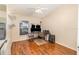 Office/bedroom with a wood grain floor, ceiling fan and a window providing natural light at 16103 Denham Ct, Clermont, FL 34711