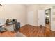 Bedroom with wood grain flooring, a closet and a door leading to another room at 16103 Denham Ct, Clermont, FL 34711