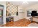 Bedroom featuring a built in desk with shelving, a window, and a wood grain floor at 16103 Denham Ct, Clermont, FL 34711