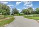 Community park featuring walking paths, picnic benches, and lush landscaping, perfect for outdoor recreation at 16103 Denham Ct, Clermont, FL 34711