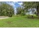 Picturesque community park with a lakeside view, picnic amenities, and lush greenery for a tranquil outdoor experience at 16103 Denham Ct, Clermont, FL 34711