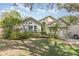 Attractive single-story home with landscaped front yard, complemented by a well-maintained lawn at 16103 Denham Ct, Clermont, FL 34711