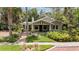 Charming home featuring a welcoming front porch, well-manicured lawn, and inviting curb appeal at 16103 Denham Ct, Clermont, FL 34711