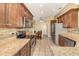 Well-equipped kitchen with stainless steel appliances, granite countertops, and ample cabinetry at 16103 Denham Ct, Clermont, FL 34711