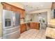 Well-equipped kitchen with stainless steel appliances, granite countertops, and ample cabinetry at 16103 Denham Ct, Clermont, FL 34711