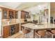 Open kitchen featuring granite countertops, stainless steel appliances, and a breakfast bar at 16103 Denham Ct, Clermont, FL 34711