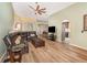 Spacious living room featuring wood floors, modern furniture, and an open floor plan at 16103 Denham Ct, Clermont, FL 34711