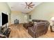 Spacious living room featuring wood floors, modern furniture, and lots of natural light at 16103 Denham Ct, Clermont, FL 34711