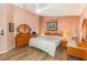 Main bedroom featuring natural light and wooden furniture at 16103 Denham Ct, Clermont, FL 34711