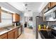Modern kitchen featuring stainless steel appliances, granite countertops, and a tile backsplash at 1647 Crestlawn Ave, Orlando, FL 32811