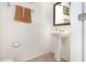 Half bath with pedestal sink and towel rack at 178 Windflower Way, Oviedo, FL 32765
