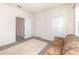 This versatile bonus room includes a closet, lots of open space, and a comfortable leather sofa at 178 Windflower Way, Oviedo, FL 32765