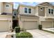 A beautiful townhome with a well-kept lawn, an attached garage, and lovely curb appeal at 178 Windflower Way, Oviedo, FL 32765