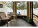 Enclosed patio featuring comfortable seating and potted plants, perfect for relaxing outdoors at 178 Windflower Way, Oviedo, FL 32765