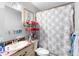 Cozy bathroom featuring a vanity with sink and a shower with a decorative curtain at 1877 Attucks Ave, Orlando, FL 32811