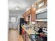 Functional kitchen with modern appliances, wooden cabinets, and a cozy layout at 1877 Attucks Ave, Orlando, FL 32811