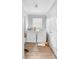 Functional laundry room with washer, dryer, and natural light from a window at 1877 Attucks Ave, Orlando, FL 32811